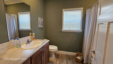 Looking for a Palm Harbor Wellington Model located in the on The Riverside Golf Club in Florida - for sale on GolfHomes.com, golf home, golf lot
