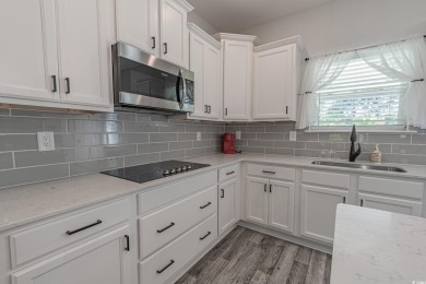 Spacious two-story home with four-bedrooms, two-and-a-half-bath on Shaftesbury Glen Golf and Fish Club in South Carolina - for sale on GolfHomes.com, golf home, golf lot