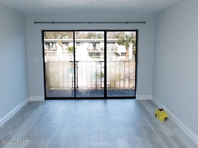 Beachside Bliss Meets Golfer's Paradise - Updated Top-Floor on Daytona Beach Golf Club in Florida - for sale on GolfHomes.com, golf home, golf lot