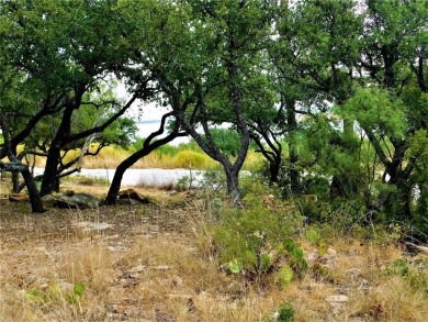 Build your dream home on this 0.44-acre waterfront lot near The on Hideout Golf Club and Resort  in Texas - for sale on GolfHomes.com, golf home, golf lot
