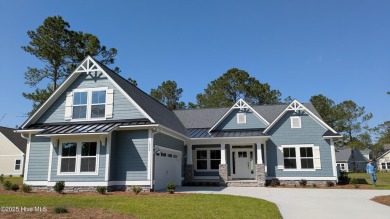 Discover the charm of Anchor, a 3-bed, 3.5-bath coastal home on Sea Trail Golf Resort in North Carolina - for sale on GolfHomes.com, golf home, golf lot