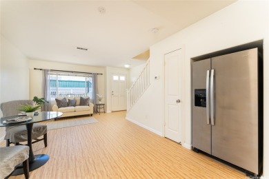 Discover the charm of this rarely available 2-bd 2.5-bath split on Hoakalei Country Club At Ocean Pointe in Hawaii - for sale on GolfHomes.com, golf home, golf lot