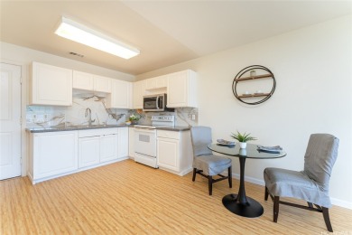Discover the charm of this rarely available 2-bd 2.5-bath split on Hoakalei Country Club At Ocean Pointe in Hawaii - for sale on GolfHomes.com, golf home, golf lot