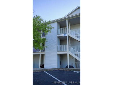 This isn't just a condo - it's a lifestyle! Wake up to sparkling on Seasons Ridge At Four Seasons in Missouri - for sale on GolfHomes.com, golf home, golf lot