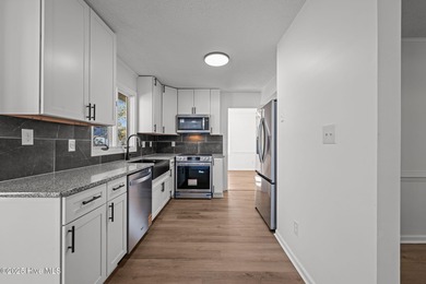 Welcome to 309 Channel Run, a stunning 3-bedroom, 2-bath home on River Bend Golf and Country Club in North Carolina - for sale on GolfHomes.com, golf home, golf lot