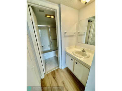 Beautiful bright and airy unit overlooking the lake and on Pine Island Ridge Country Club in Florida - for sale on GolfHomes.com, golf home, golf lot