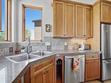 This spacious Mediterranean style patio home in the heart of The on The Golf Club At Redlands Mesa in Colorado - for sale on GolfHomes.com, golf home, golf lot