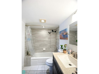 BACK ON THE MARKET WITH NEW KITCHEN WATERFALL COUNTERTOP AND on Wynmoor Golf Course in Florida - for sale on GolfHomes.com, golf home, golf lot