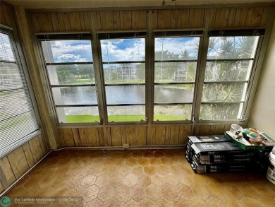 Beautiful bright and airy unit overlooking the lake and on Pine Island Ridge Country Club in Florida - for sale on GolfHomes.com, golf home, golf lot