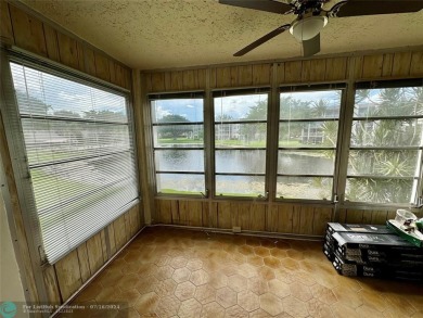 Beautiful bright and airy unit overlooking the lake and on Pine Island Ridge Country Club in Florida - for sale on GolfHomes.com, golf home, golf lot