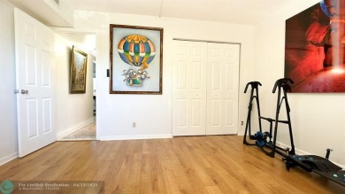 BACK ON THE MARKET WITH NEW KITCHEN WATERFALL COUNTERTOP AND on Wynmoor Golf Course in Florida - for sale on GolfHomes.com, golf home, golf lot