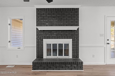 Welcome to 309 Channel Run, a stunning 3-bedroom, 2-bath home on River Bend Golf and Country Club in North Carolina - for sale on GolfHomes.com, golf home, golf lot