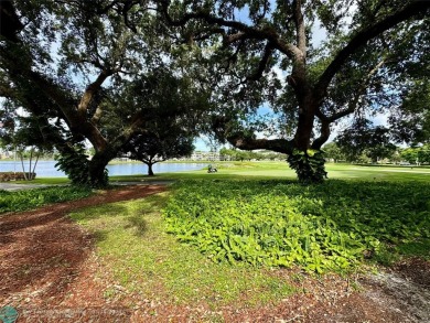 Beautiful bright and airy unit overlooking the lake and on Pine Island Ridge Country Club in Florida - for sale on GolfHomes.com, golf home, golf lot