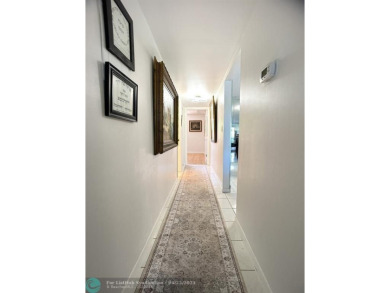 BACK ON THE MARKET WITH NEW KITCHEN WATERFALL COUNTERTOP AND on Wynmoor Golf Course in Florida - for sale on GolfHomes.com, golf home, golf lot