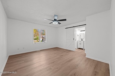 Welcome to 309 Channel Run, a stunning 3-bedroom, 2-bath home on River Bend Golf and Country Club in North Carolina - for sale on GolfHomes.com, golf home, golf lot