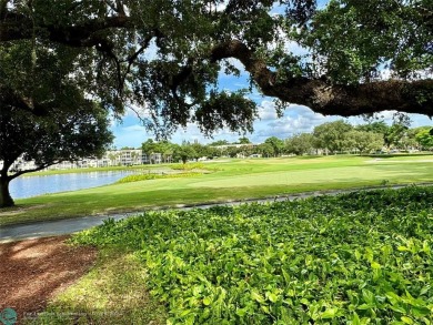 Beautiful bright and airy unit overlooking the lake and on Pine Island Ridge Country Club in Florida - for sale on GolfHomes.com, golf home, golf lot