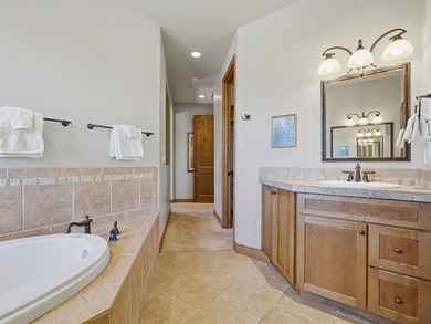 This spacious Mediterranean style patio home in the heart of The on The Golf Club At Redlands Mesa in Colorado - for sale on GolfHomes.com, golf home, golf lot