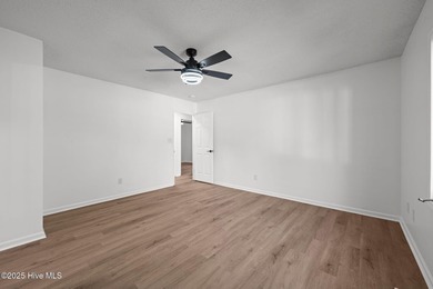 Welcome to 309 Channel Run, a stunning 3-bedroom, 2-bath home on River Bend Golf and Country Club in North Carolina - for sale on GolfHomes.com, golf home, golf lot