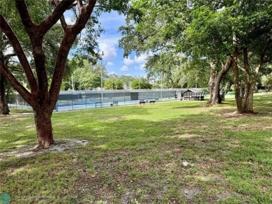Beautiful bright and airy unit overlooking the lake and on Pine Island Ridge Country Club in Florida - for sale on GolfHomes.com, golf home, golf lot