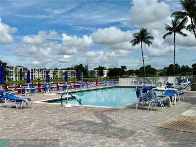 Beautiful bright and airy unit overlooking the lake and on Pine Island Ridge Country Club in Florida - for sale on GolfHomes.com, golf home, golf lot