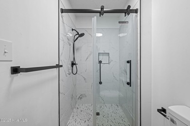 Welcome to 309 Channel Run, a stunning 3-bedroom, 2-bath home on River Bend Golf and Country Club in North Carolina - for sale on GolfHomes.com, golf home, golf lot