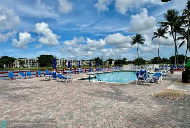 Beautiful bright and airy unit overlooking the lake and on Pine Island Ridge Country Club in Florida - for sale on GolfHomes.com, golf home, golf lot