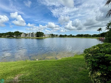 Beautiful bright and airy unit overlooking the lake and on Pine Island Ridge Country Club in Florida - for sale on GolfHomes.com, golf home, golf lot