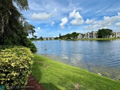 Beautiful bright and airy unit overlooking the lake and on Pine Island Ridge Country Club in Florida - for sale on GolfHomes.com, golf home, golf lot