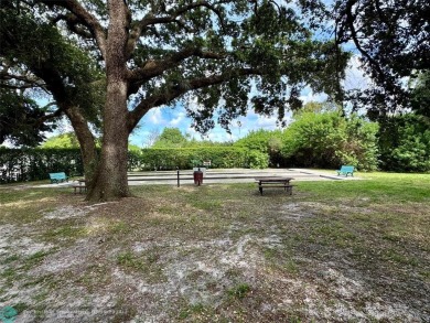 Beautiful bright and airy unit overlooking the lake and on Pine Island Ridge Country Club in Florida - for sale on GolfHomes.com, golf home, golf lot