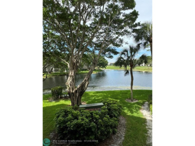 Beautiful bright and airy unit overlooking the lake and on Pine Island Ridge Country Club in Florida - for sale on GolfHomes.com, golf home, golf lot