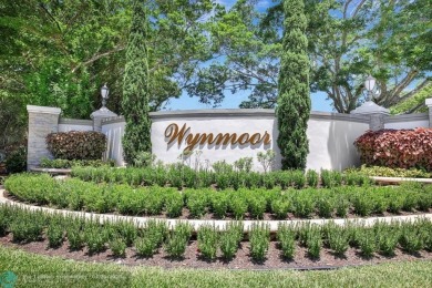 BACK ON THE MARKET WITH NEW KITCHEN WATERFALL COUNTERTOP AND on Wynmoor Golf Course in Florida - for sale on GolfHomes.com, golf home, golf lot