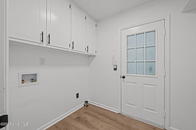 Welcome to 309 Channel Run, a stunning 3-bedroom, 2-bath home on River Bend Golf and Country Club in North Carolina - for sale on GolfHomes.com, golf home, golf lot