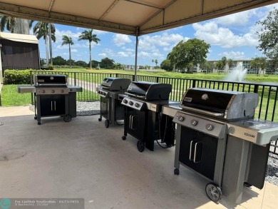 BACK ON THE MARKET WITH NEW KITCHEN WATERFALL COUNTERTOP AND on Wynmoor Golf Course in Florida - for sale on GolfHomes.com, golf home, golf lot