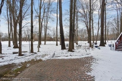 Location, location, location! This five-bedroom, four-full-bath on Prestwick Village Golf Club in Michigan - for sale on GolfHomes.com, golf home, golf lot