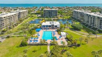 Under contract-accepting backup offers. Beachfront living at its on Longboat Key Golf Club in Florida - for sale on GolfHomes.com, golf home, golf lot