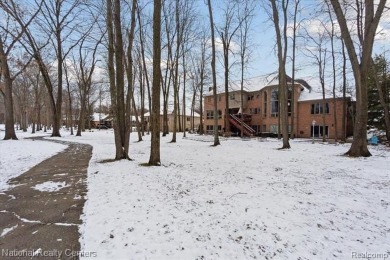 Location, location, location! This five-bedroom, four-full-bath on Prestwick Village Golf Club in Michigan - for sale on GolfHomes.com, golf home, golf lot