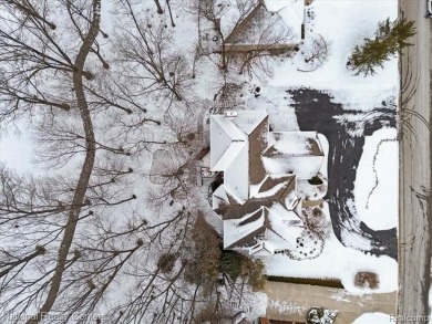 Location, location, location! This five-bedroom, four-full-bath on Prestwick Village Golf Club in Michigan - for sale on GolfHomes.com, golf home, golf lot