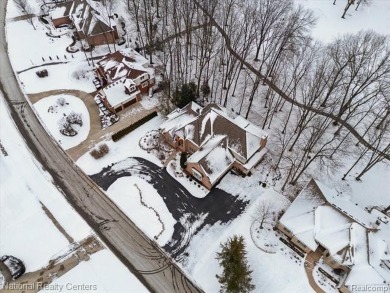 Location, location, location! This five-bedroom, four-full-bath on Prestwick Village Golf Club in Michigan - for sale on GolfHomes.com, golf home, golf lot