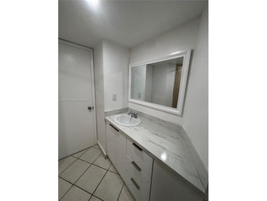 Beautifully updated apartment offering true peace of mind and on Country Club of Miami in Florida - for sale on GolfHomes.com, golf home, golf lot