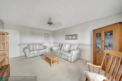 SPACIOUS 2/2 PENTHOUSE CORNER UNIT IN MANICURED 55+ LAKES OF on Inverrary Country Club in Florida - for sale on GolfHomes.com, golf home, golf lot