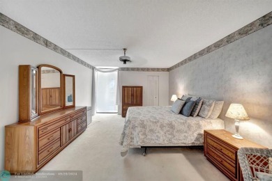SPACIOUS 2/2 PENTHOUSE CORNER UNIT IN MANICURED 55+ LAKES OF on Inverrary Country Club in Florida - for sale on GolfHomes.com, golf home, golf lot