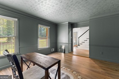 Discover this beautifully maintained brick 4-bedroom, 2.5-bath on Canongate At Flat Creek Club in Georgia - for sale on GolfHomes.com, golf home, golf lot