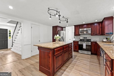 Discover this beautifully maintained brick 4-bedroom, 2.5-bath on Canongate At Flat Creek Club in Georgia - for sale on GolfHomes.com, golf home, golf lot
