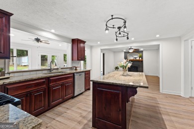 Discover this beautifully maintained brick 4-bedroom, 2.5-bath on Canongate At Flat Creek Club in Georgia - for sale on GolfHomes.com, golf home, golf lot