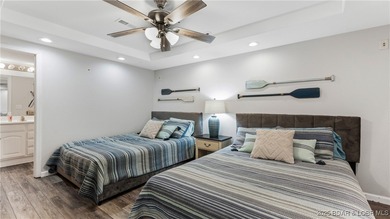 Enjoy incredible lake views from this spacious 4-bedroom, 3-bath on Tan-Tar-A Golf Club in Missouri - for sale on GolfHomes.com, golf home, golf lot