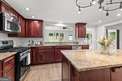 Discover this beautifully maintained brick 4-bedroom, 2.5-bath on Canongate At Flat Creek Club in Georgia - for sale on GolfHomes.com, golf home, golf lot