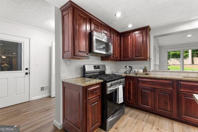 Discover this beautifully maintained brick 4-bedroom, 2.5-bath on Canongate At Flat Creek Club in Georgia - for sale on GolfHomes.com, golf home, golf lot