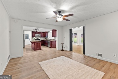 Discover this beautifully maintained brick 4-bedroom, 2.5-bath on Canongate At Flat Creek Club in Georgia - for sale on GolfHomes.com, golf home, golf lot