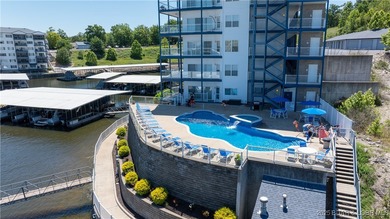 Enjoy incredible lake views from this spacious 4-bedroom, 3-bath on Tan-Tar-A Golf Club in Missouri - for sale on GolfHomes.com, golf home, golf lot
