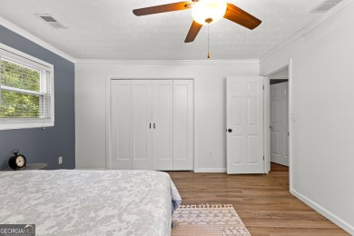 Discover this beautifully maintained brick 4-bedroom, 2.5-bath on Canongate At Flat Creek Club in Georgia - for sale on GolfHomes.com, golf home, golf lot
